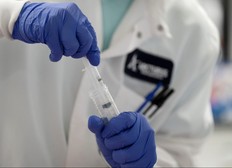 A scientist conducts research on a vaccine for the novel coronavirus (COVID-19).