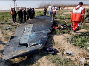 General view of the debris of the Ukraine International Airlines, flight PS752, Boeing 737-800 plane that crashed after take-off from Iran's Imam Khomeini airport, on the outskirts of Tehran, Iran Jan. 8, 2020 is seen in this screen grab obtained from a social media video via REUTERS.