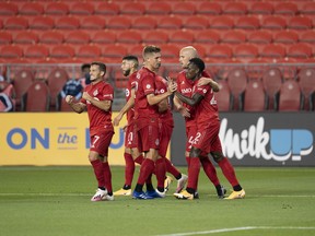 Toronto FC midfielder Richie Laryea (22) celebrates scoring a goal against Vancouver on Friday night.