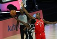 Raptors' Serge Ibaka defends at the rim against Nets' Caris LeVert during their game on Sunday.