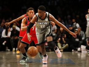 Brooklyn Nets guard Caris LeVert (22) and Toronto Raptors guard Kyle Lowry (7) pursue a loose ball during the first half at Barclays Center. Mandatory Credit: Andy Marlin-USA TODAY Sports ORG XMIT: USATSI-407526