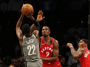 Brooklyn Nets guard Caris LeVert (22) shoots against Raptors center Serge Ibaka. The two teams will meet the the first round of the playoffs.