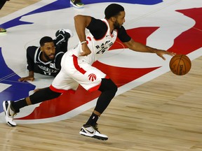 Norman Powell of the Toronto Raptors steals the ball from Garrett Temple of the Brooklyn Nets during the fourth quarter in Game 2 of the Eastern Conference quarterfinal yesterday.
