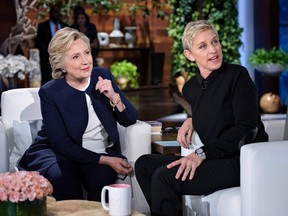 Democratic presidential nominee Hillary Clinton, left, and TV host Ellen DeGeneres talk during a commercial break of the taping of the Ellen Show on Oct. 13, 2016 in Burbank, Calif.