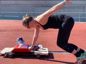 Elisabeth working out, while Hendrix enjoys the ride on her skeleton sled.