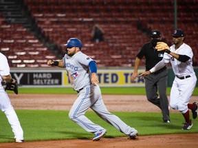 Blue Jays` Rowdy Tellez gets caught in a rundown in Boston on Saturday night. (Getty images)