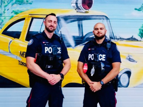 Two Toronto police officers don body-worn cameras, which debuted Monday night in Rexdale, according to a tweet from Deputy Chief Shawna Coxon.