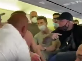 A video depicts a brawl erupting aboard an Ibiza-bound flight after two passengers refused to wear masks.