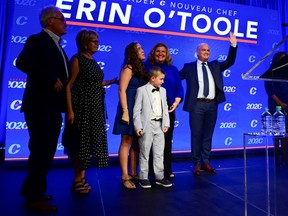 Newly elected Conservative Leader Erin O?Toole stands with his parents and his wife and children after his winning speech following the Conservative party of Canada 2020 Leadership Election in Ottawa, Ontario, Canada August 24, 2020.  Sean Kilpatrick/Pool via REUTERS ORG XMIT: SKP516