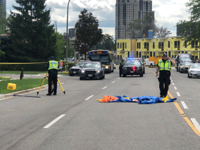 Toronto Police at the scene on The East Mall after a toddler was killed and his sister injured by a vehicle on Tuesday, Aug. 11, 2020.