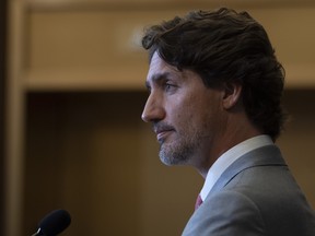 Prime Minister Justin Trudeau listens to a question during a news conference on Parliament Hill in Ottawa, Tuesday, Aug. 18, 2020.