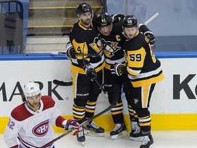 Pittsburgh Penguins captain Sidney Crosby (centre) celebrates a goal last night against the Montreal Canadians during Game 2 of their best-of-five series, which is tied 1-1.  Getty Images