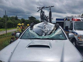 Three people are lucky to be alive after  a wheel separated from a vehicle on Highway 400 and collided with a truck.