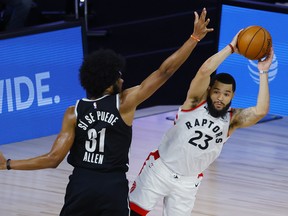 Raptors’ Fred VanVleet looks to pass while being guarded by Brooklyn Nets’ Jarrett Allen during Game 2 in Lake Buena Vista, Fla.