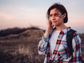 A hiker ponders how to tell a co-worker/friend that she wants to go on solo trips.