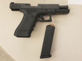 This Glock 9mm pistol is allegedly one of two loaded handguns seized when two men were arrested after a woman was assaulted in the city's Port Lands on Monday, Aug. 10, 2020.