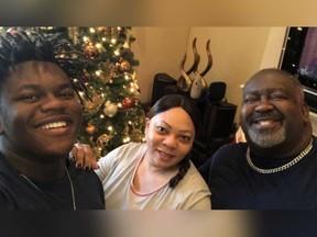 Justin Hunter, left, is pictured with his mother, Angie, and dad, Eugene.