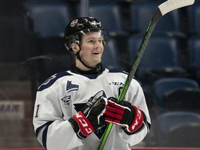 Alexis Lafreniere (11) smiles while looking at his results on the clock during the Kubota OHL/NHL Top Prospects team white on-ice skills testing in Hamilton, Ont. on January 15, 2020.   THE CANADIAN PRESS/Peter Power ORG XMIT: JCO101