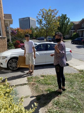 Landlord Amy Chen, right, arrives at 2 Wilket Creek Rd. in Toronto