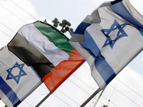 Israeli and United Arab Emirates flags line a road in the Israeli coastal city of Netanya, on Aug. 16, 2020.