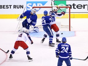 Columbus Blue Jackets players celebrate a goal against the Maple Leafs in Game 5 of their Eastern Conference play-in series on Sunday.