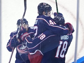 Pierre-Luc Dubois, No. 18, and his teammates celebrate after he scored the OT winner versus the Leafs on Thursday. GETTY IMAGES