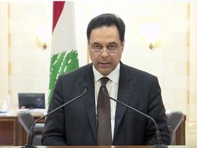 Lebanon's Prime Minister Hassan Diab speaks at the government palace in Beirut, Lebanon, August 10, 2020, in this still picture taken from a video.