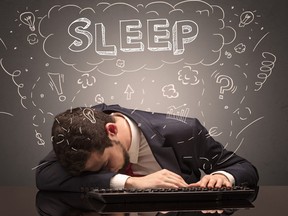 Businessman fell asleep at his workplace with ideas, sleep and tired concept