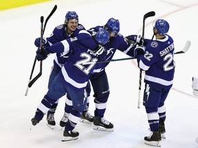 Brayden Point and the Tampa Bay Lightning celebrate his game-winning goal against the Columbus Blue Jackets at Scotiabank Arena on August 11, 2020 in Toronto.