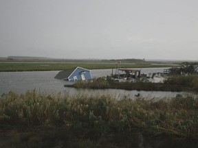 A house submerged in a lake is seen on August 28, 2020 in Carlyss, Louisiana.