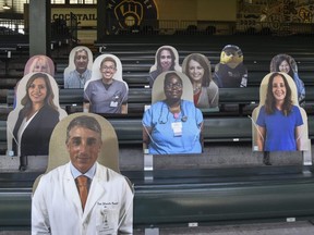 Cutouts of fans were placed in the right field bleachers at Miller Park in Milwaukee, but the game between the Brewers and Cardinals was cancelled due to the pandemic, Friday, July 31, 2020.