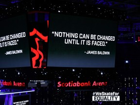 A quote by James Baldwin is displayed on the scoreboard at Scotiabank Arena in Toronto on Saturday. Sports leagues around North America are taking a stand against social injustice. Elsa/Getty Images