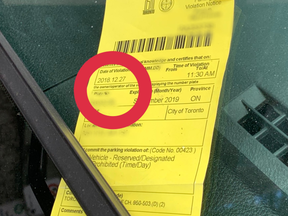 An image posted Aug. 18, 2020 by a Toronto parking enforcement officer of an old parking tag on an illegally parked vehicle.