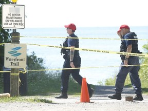 Durham Regional Police officers search area at the bottom of Frisco Rd. west of Duffin's Creek in Pickering. The body of an infant boy had washed up on the shoreline and found by a woman walking along the beach on Thursday at 3:30 p.m. on Friday August 7, 2020.