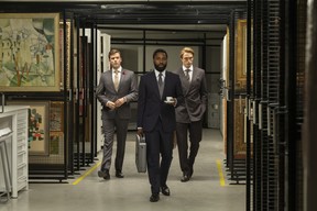 (L-r) Jack Cutmore-Scott, John David Washington and Robert Pattinson in Warner Bros. Pictures’ action epic Tenet, a Warner Bros. Pictures release.