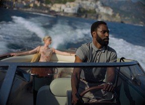 Elizabeth Debicki and John David Washington in Warner Bros. Pictures’ action epic Tenet, a Warner Bros. Pictures release.