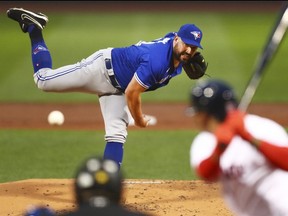 Blue Jays pitcher Tanner Roark delivers the pitch against the Boston Red Sox at Fenway Park last night.  (Getty Images)
