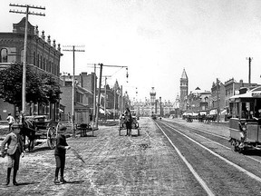 The unusual width of Spadina Ave., two chains (132 feet) wide is obvious in this view. This thoroughfare was originally laid out by landowner Dr. William Warren Baldwin to take advantage of a clear view of Lake Ontario from his residence on the escarpment, a place he called Spadina (pronounced Spadeena). This c1900 view looks north opposite Baldwin St. The historic Knox College in Spadina Circle is far in the distance.