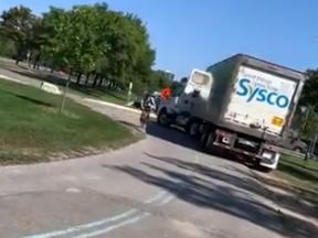 A Sysco transport truck is seen travelling on the Martin Goodman Trail Friday, a pathway reserved for cyclists, pedestrians and skaters.