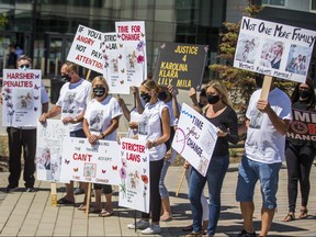 A group of protesters gathered outside of a Brampton courthouse on the first day of 20-year-old Brady RobertsonÕs bail hearing in Brampton, Ont. on Thursday August 20, 2020. The Caledon man faces charges of four counts of dangerous operation of a motor vehicle causing death in the Brampton crash on June 18 that claimed the lives of a mother and her three young daughters.