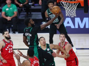 Boston Celtics guard Jaylen Brown makes a layup against the Toronto Raptors during Game 5 on Monday.
