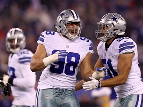 Tyrone Crawford (left) of the Dallas Cowboys  was one of 10 Canadians to make an active NFL roster.