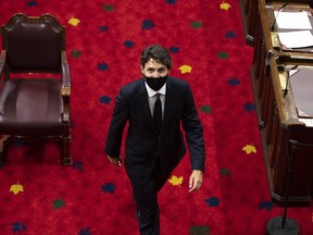 Prime Minister Justin Trudeau heads back to his seat before the delivery of the Speech from the Throne at the Senate of Canada Building in Ottawa, on Wednesday, Sept. 23, 2020.