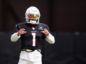 Cardinals quarterback Kyler Murray looks on during practice.