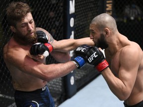 In this handout image provided by UFC, Khamzat Chimaev, right, of Chechnya punches Gerald Meerschaert in their middleweight bout during the UFC Fight Night event at UFC APEX on Sept. 19, 2020 in Las Vegas, Nevada.