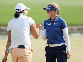 Brooke M. Henderson (R) of Canada congratulates Mirim Lee of the Republic of Korea after Lee won the ANA Inspiration in a sudden death playoff on the Dinah Shore course at Mission Hills Country Club on September 13, 2020 in Rancho Mirage, California.