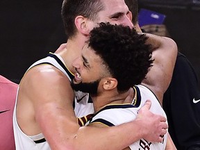 Nuggets teammates Jamal Murray (right) and Nikola Jokic celebrate after beating the Clippers to advance to face the Lakers in the Western Conference final.