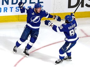 Ondrej Palat of the Tampa Bay Lightning is congratulated by Nikita Kucherov after scoring a goal against the Dallas Stars during the second period in Game Five of the 2020 NHL Stanley Cup Final at Rogers Place on September 26, 2020 in Edmonton, Alberta, Canada.