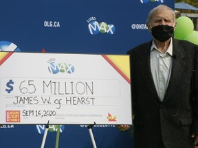 James Wickman with his $65 million Lotto Max cheque.