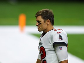 Tampa Bay Buccaneers quarterback Tom Brady walks off the field after a 34-23 loss against the New Orleans Saints on Sunday.